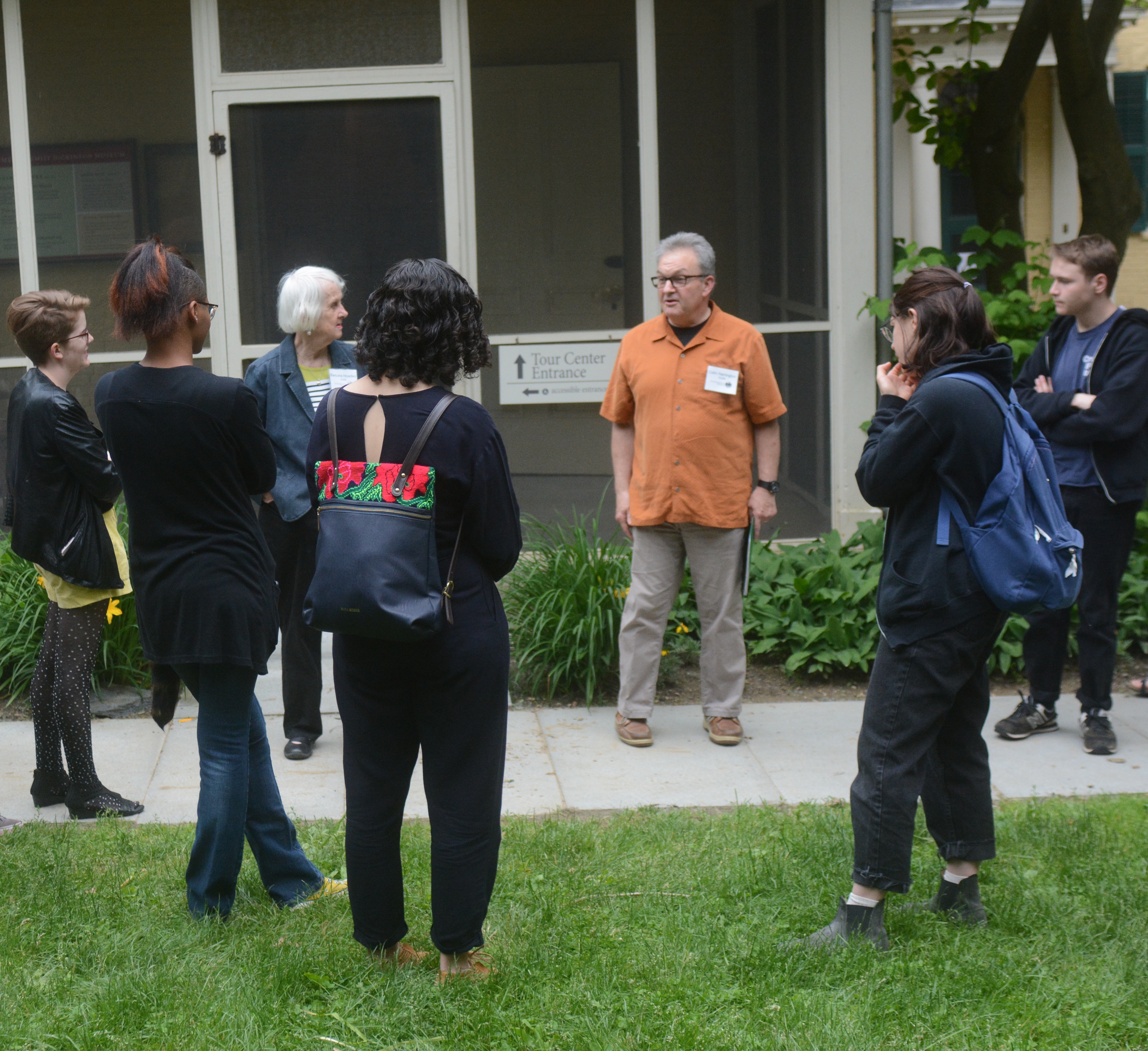 A guided tour standing outside the Homestead