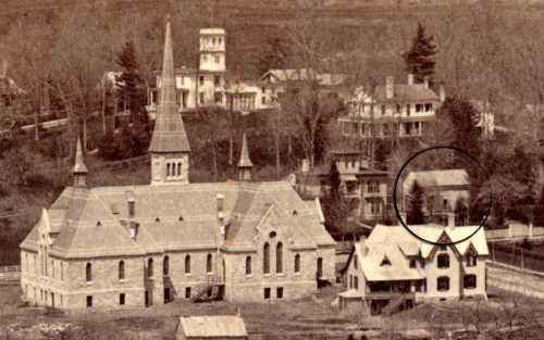 Archival photograph of The Evergreens and Carriage House (in middle ground of photo)